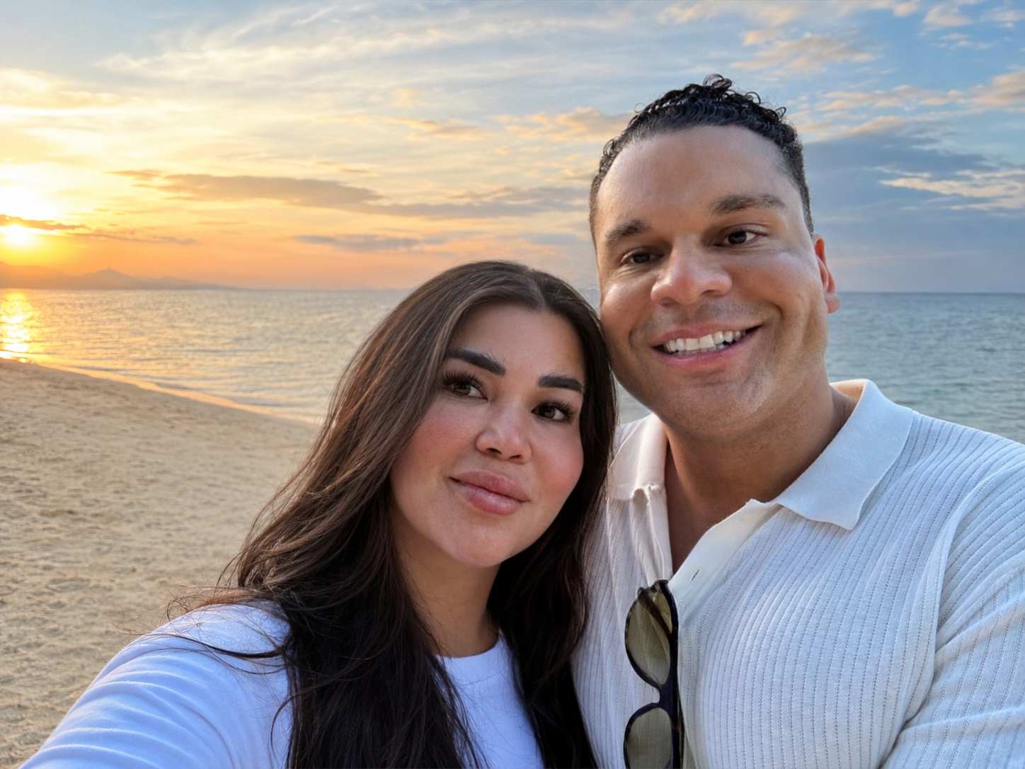 Lo Wier and Dr. Roxborough at sunset by the ocean