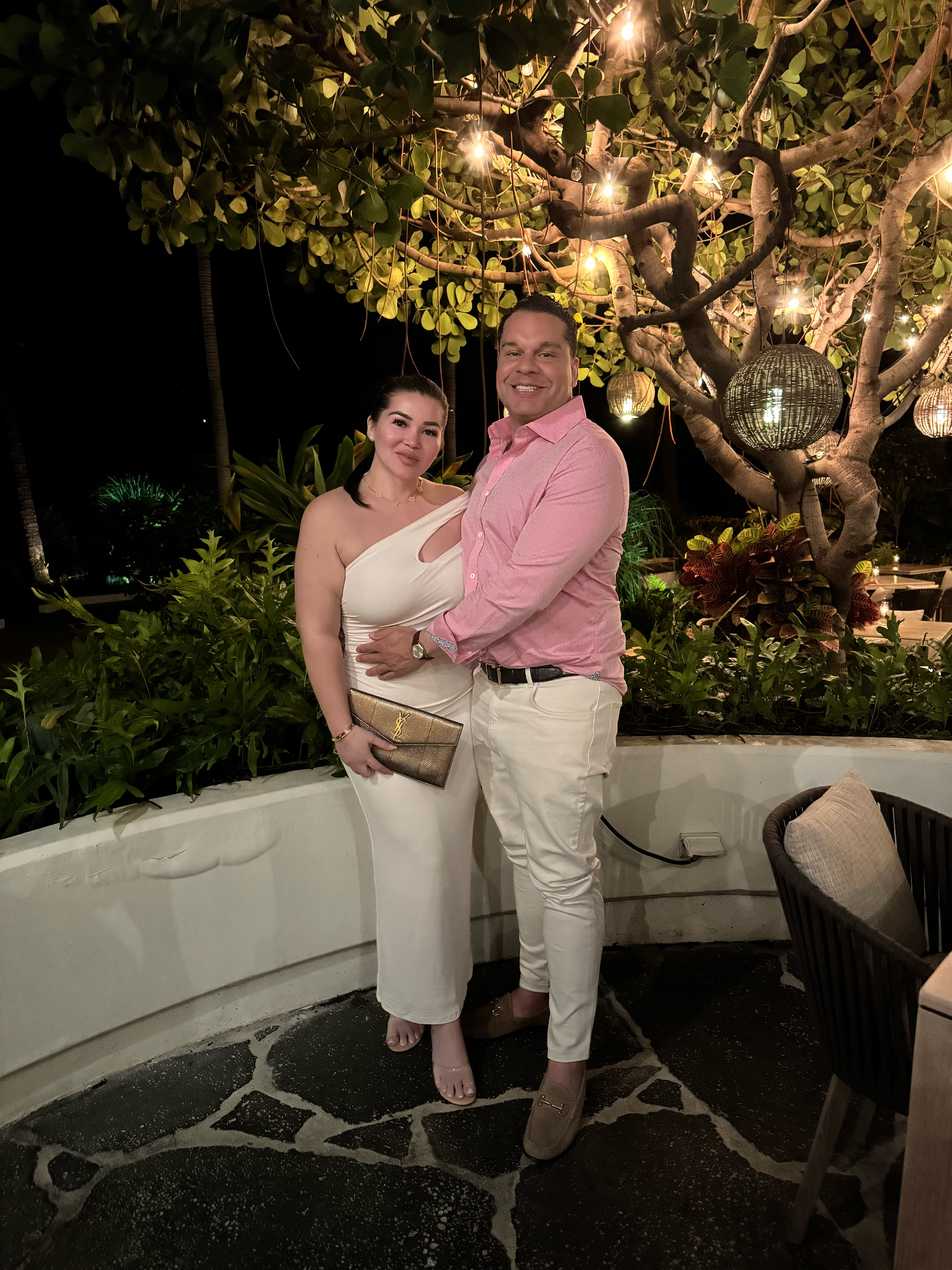Lo Wier and Dr. Roxborough beneath an illuminated tree